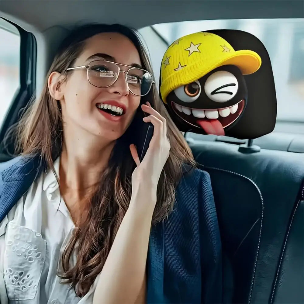 2Pcs Cute Black Coal Ball Car Headrest Covers, Yellow Star Beanie Winking Tongue Out, close-up view
