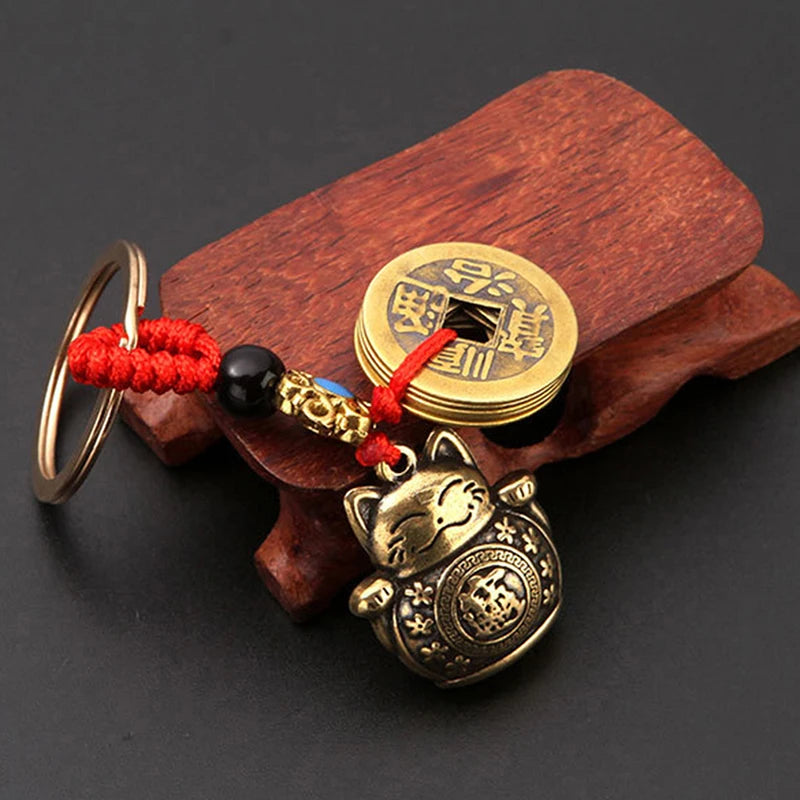 Brass Lucky Cat Keychain with Five Emperor Coins lifestyle view