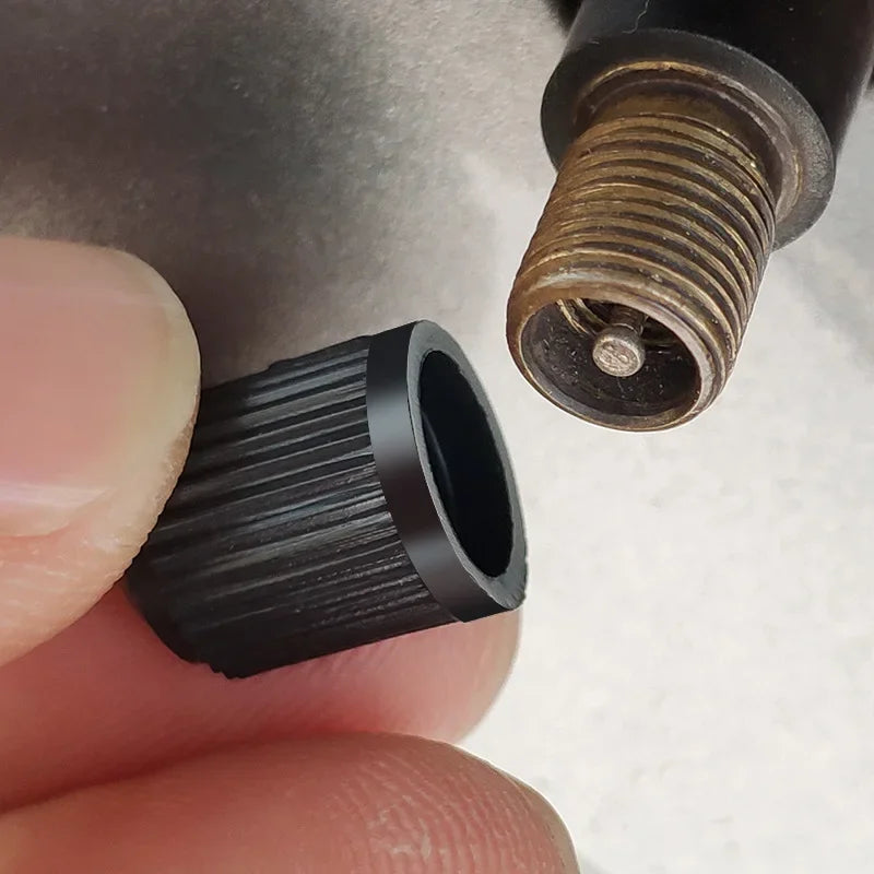 Plastic Tire Valve Dust Caps | Universal Schrader Stem Covers for Car, Bike, Truck close-up view